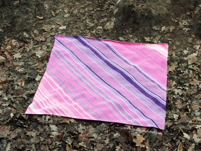 temperature crochet blanket outdoors on the ground of leaves